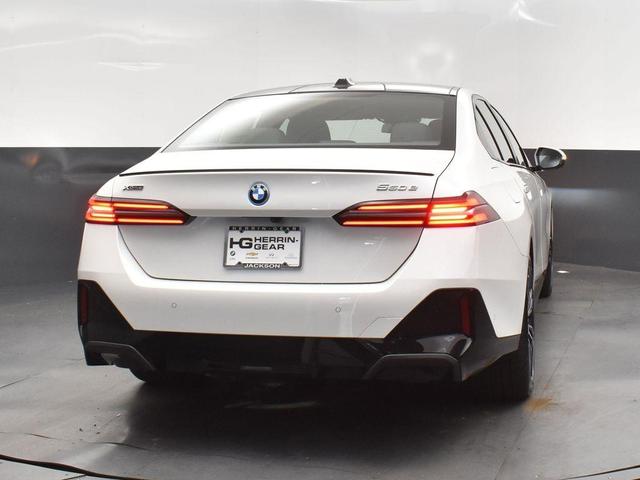 Photo of 2026 Mineral White Metallic BMW 550e