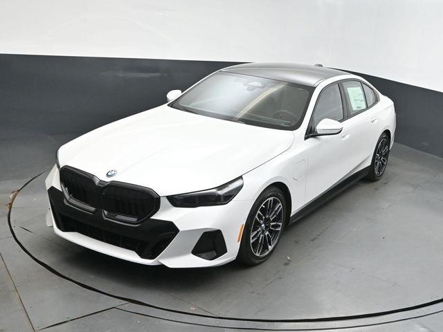 Photo of 2026 Mineral White Metallic BMW 550e