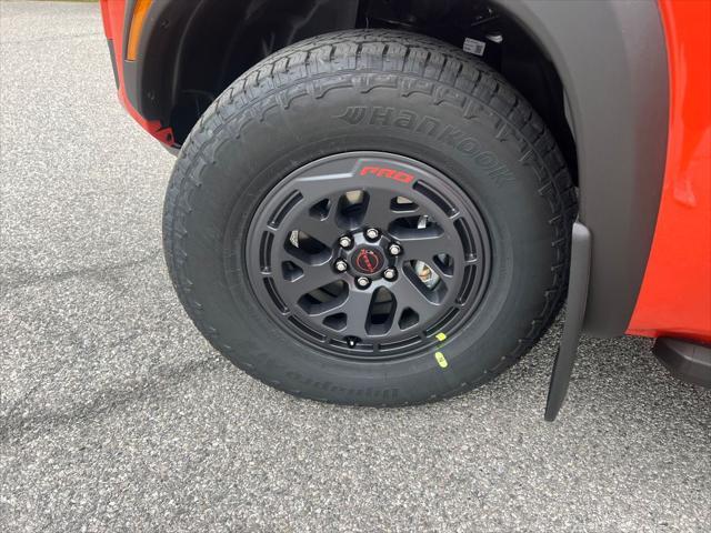 Photo of 2025 Afterburn Orange Nissan Frontier