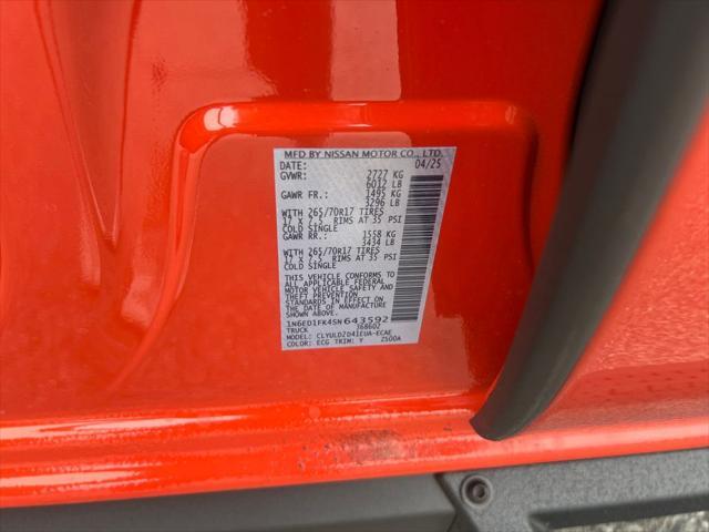 Photo of 2025 Afterburn Orange Nissan Frontier