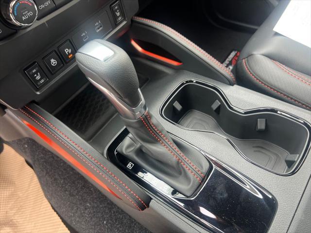 Photo of 2025 Afterburn Orange Nissan Frontier