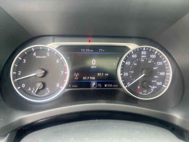 Photo of 2025 Aspen White Tricoat/Super Black Nissan Sentra