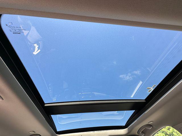 Photo of 2023 Pearl White Tricoat Nissan Rogue