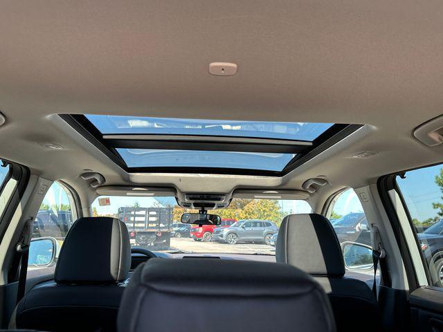 Photo of 2023 Pearl White Tricoat Nissan Rogue