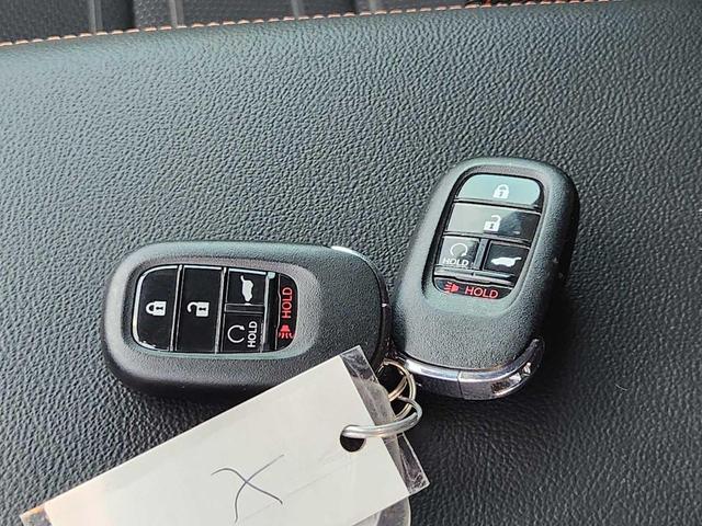 Photo of 2024 Radiant Red Metallic Honda CR-V Hybrid