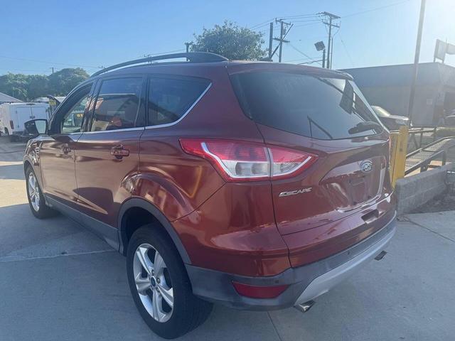 Photo of 2014 Sunset Metallic Ford Escape