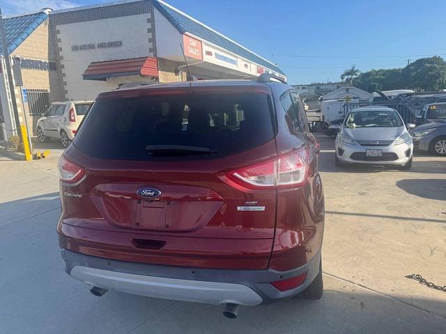 Photo of 2014 Sunset Metallic Ford Escape