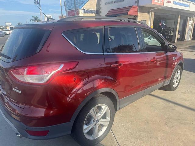 Photo of 2014 Sunset Metallic Ford Escape