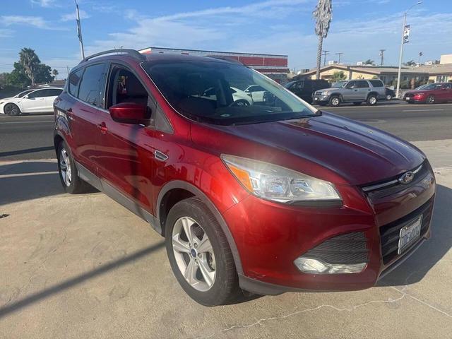 Photo of 2014 Sunset Metallic Ford Escape