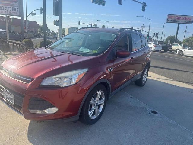Photo of 2014 Sunset Metallic Ford Escape