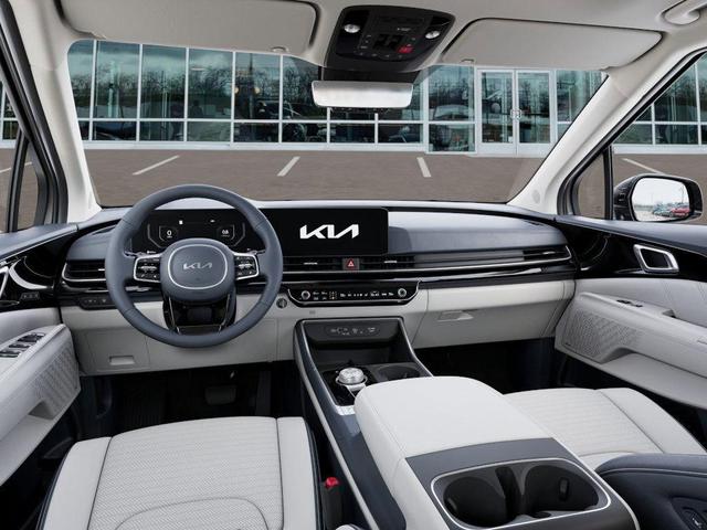 Photo of 2025 Ivory Silver Kia Carnival Hybrid