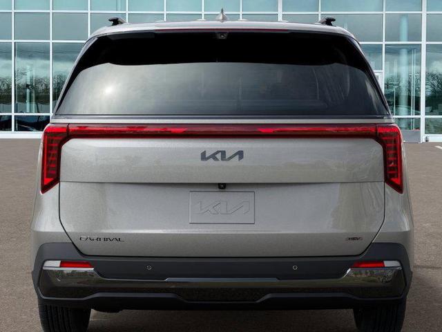 Photo of 2025 Ivory Silver Kia Carnival Hybrid