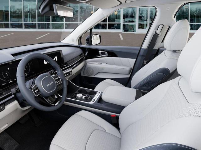 Photo of 2025 Ivory Silver Kia Carnival Hybrid