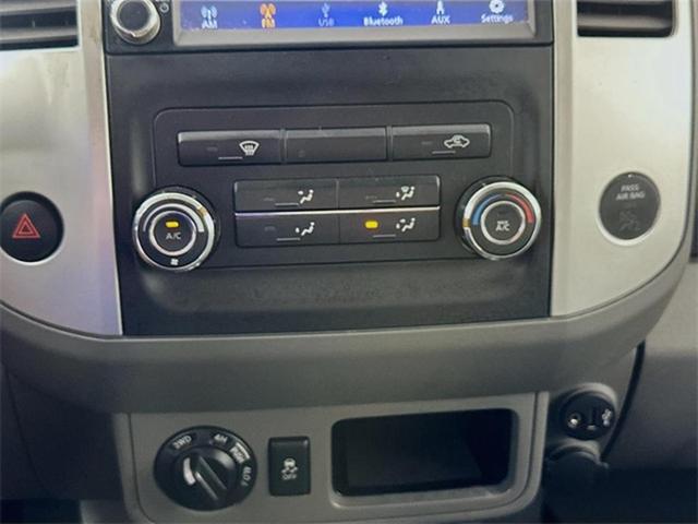 Photo of 2019 Magnetic Black Pearl Nissan Frontier