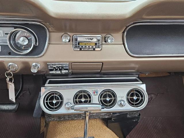 Photo of 1965 Yellow Ford Mustang