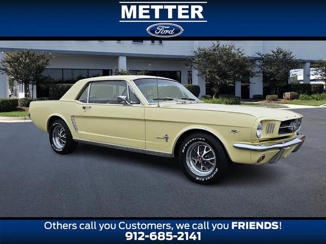 Photo of 1965 Yellow Ford Mustang