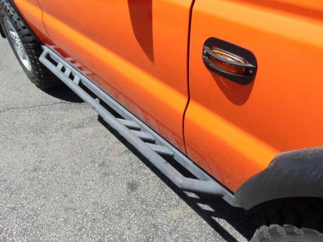 Photo of 2003 Orange Land Rover Discovery