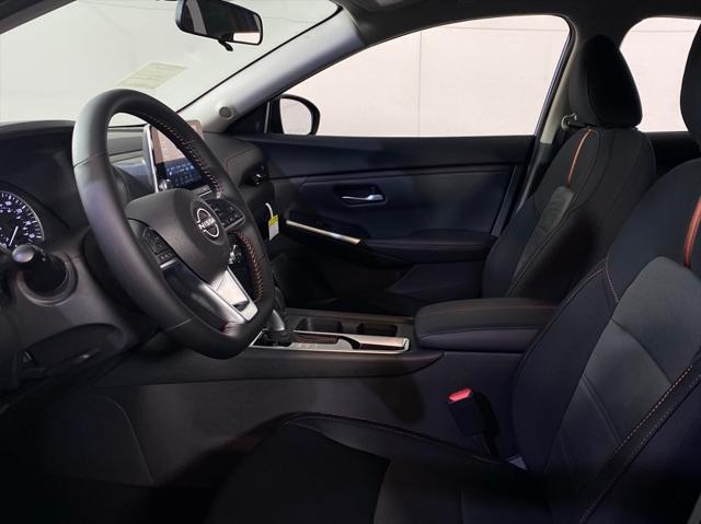 Photo of 2025 Aspen White Tricoat/Super Black Nissan Sentra