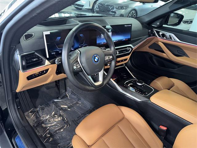 Photo of 2024 Black Sapphire Metallic BMW i4 Gran Coupe