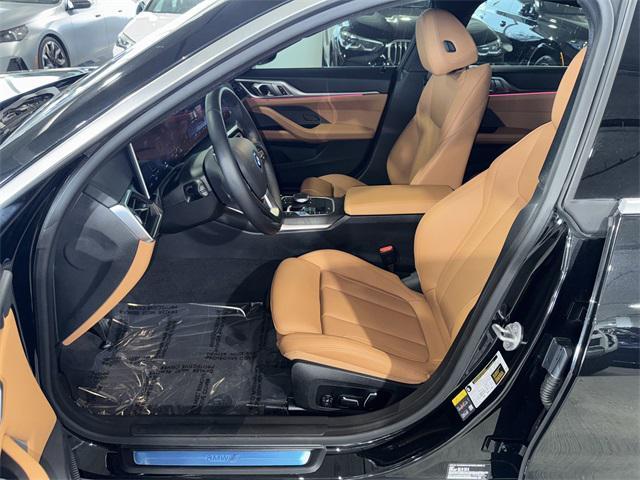 Photo of 2024 Black Sapphire Metallic BMW i4 Gran Coupe