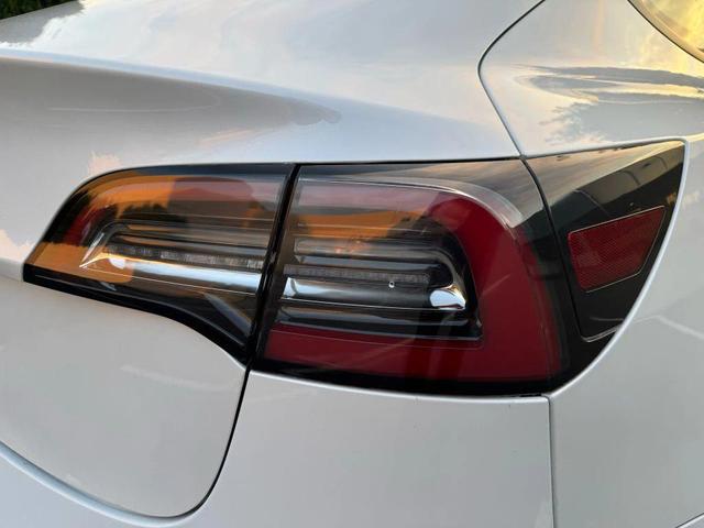 Photo of 2021 Pearl White Multi-Coat Tesla Model 3