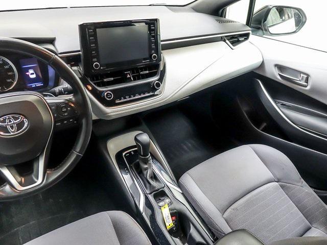 Photo of 2022 White w/Black Sand Pearl Roof Toyota Corolla