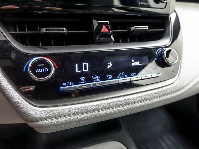 Photo of 2022 White w/Black Sand Pearl Roof Toyota Corolla