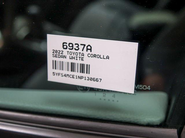 Photo of 2022 White w/Black Sand Pearl Roof Toyota Corolla