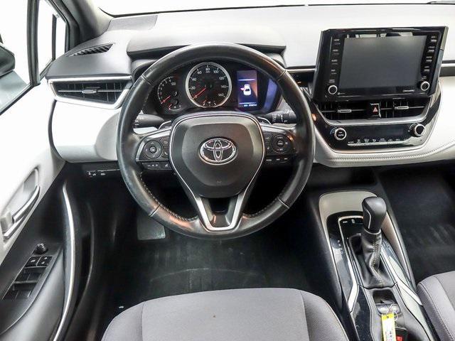 Photo of 2022 White w/Black Sand Pearl Roof Toyota Corolla