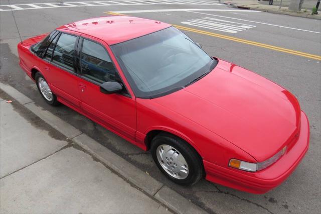 Photo of 1997 Bright Red Oldsmobile Cutlass Supreme
