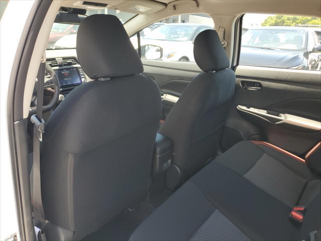 Photo of 2025 Aspen White Tricoat Nissan Versa