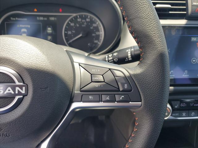 Photo of 2025 Aspen White Tricoat Nissan Versa