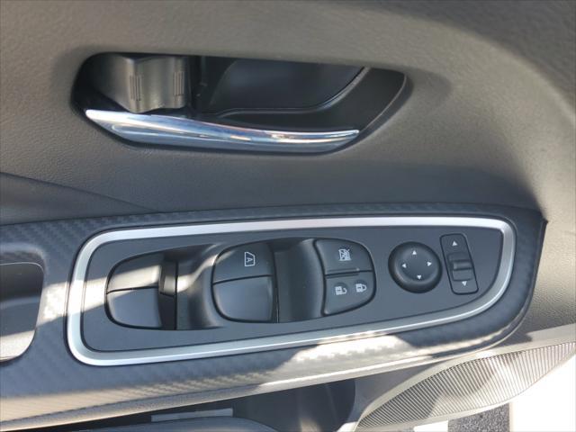 Photo of 2025 Aspen White Tricoat Nissan Versa