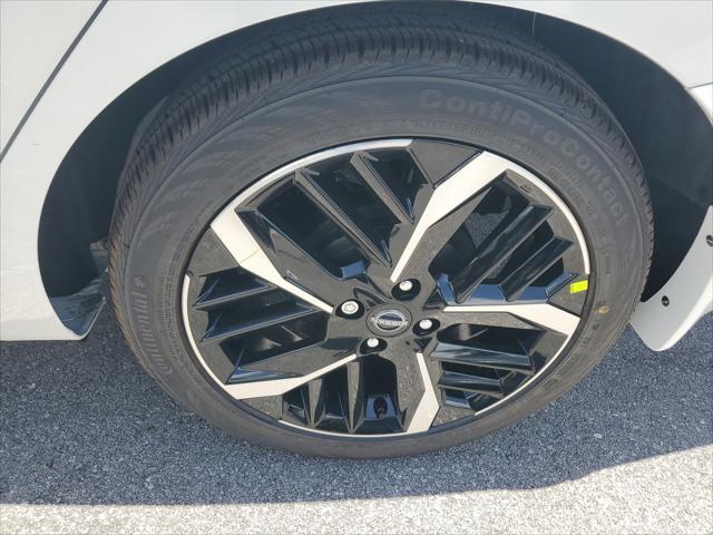 Photo of 2025 Aspen White Tricoat Nissan Versa