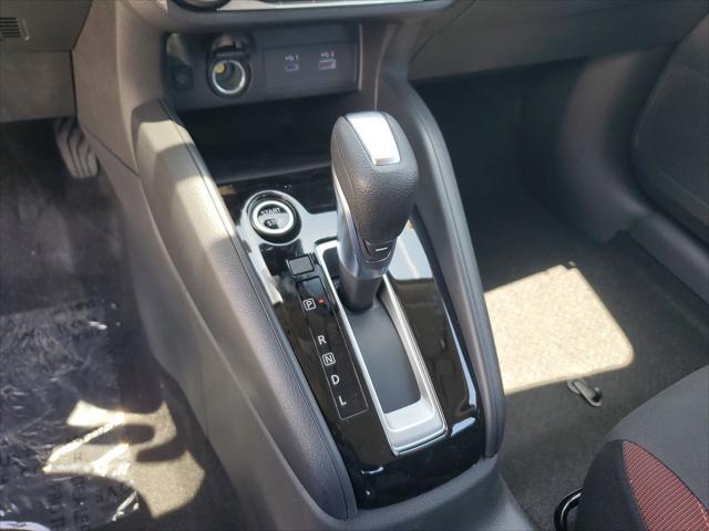 Photo of 2025 Aspen White Tricoat Nissan Versa