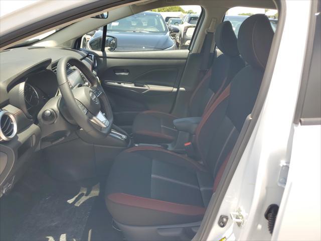 Photo of 2025 Aspen White Tricoat Nissan Versa