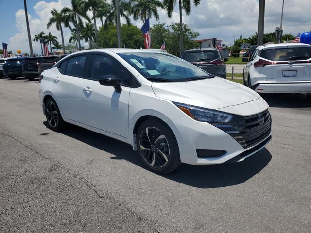 Photo of 2025 Aspen White Tricoat Nissan Versa