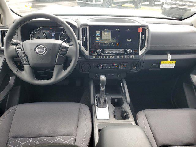 Photo of 2025 Glacier White Nissan Frontier