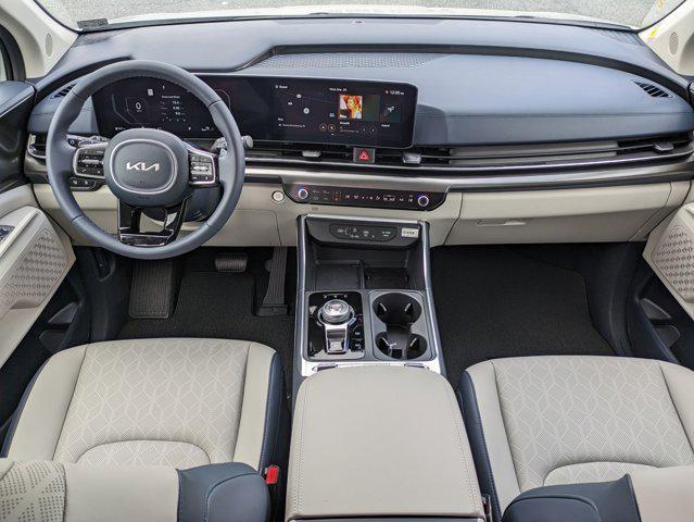 Photo of 2025 Ivory Silver Kia Carnival Hybrid