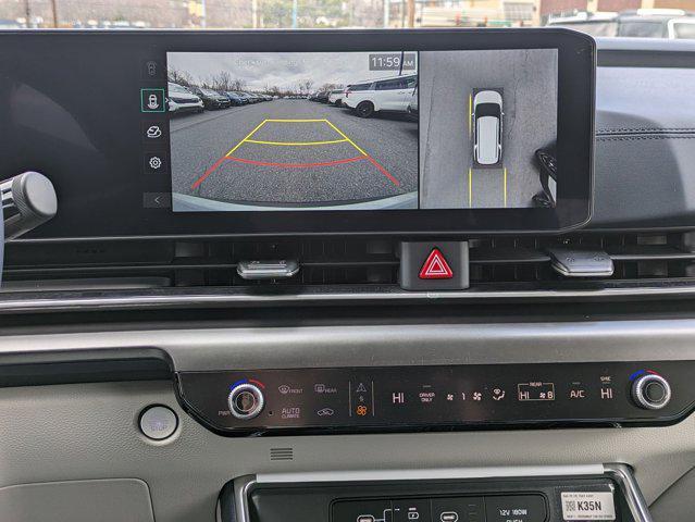 Photo of 2025 Ivory Silver Kia Carnival Hybrid