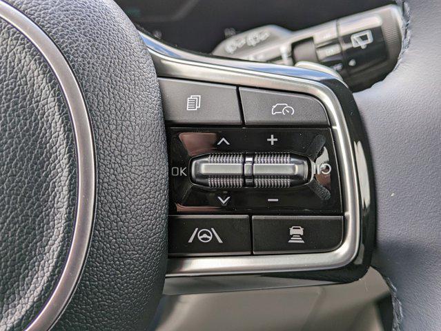 Photo of 2025 Ivory Silver Kia Carnival Hybrid