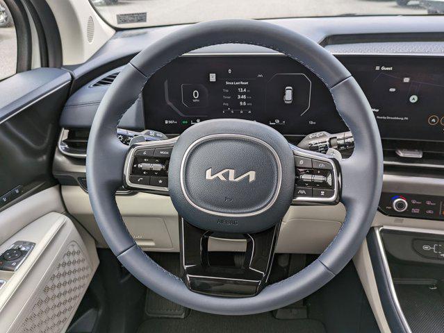 Photo of 2025 Ivory Silver Kia Carnival Hybrid