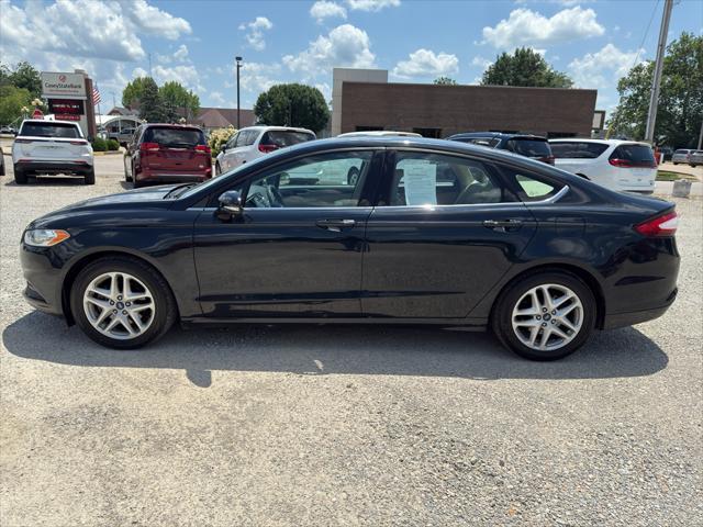 Photo of 2014 Dark Side Metallic Ford Fusion