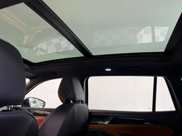 Photo of 2025 Avocado Green w/Deep Black Roof Volkswagen Tiguan