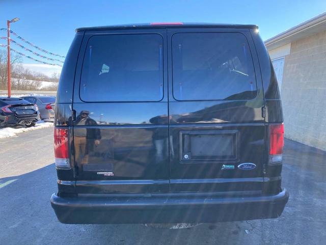Photo of 2012 Black Ford E350 Super Duty