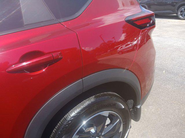 Photo of 2024 Scarlet Ember Tintcoat Nissan Rogue