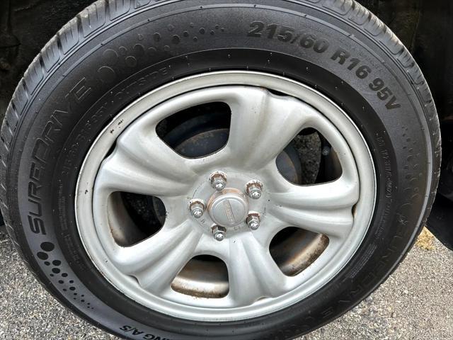 Photo of 2003 Woodland Green Pearl/Textured Gray Subaru Forester