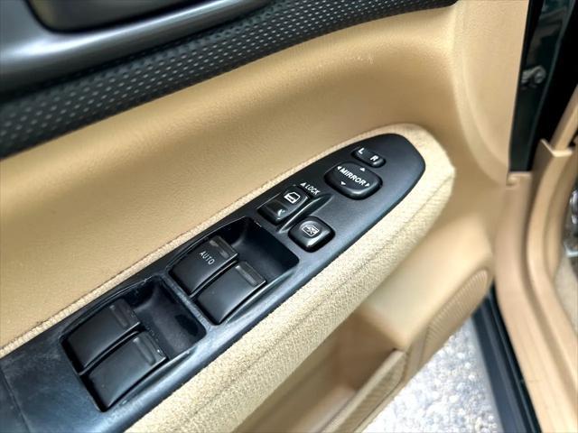 Photo of 2003 Woodland Green Pearl/Textured Gray Subaru Forester