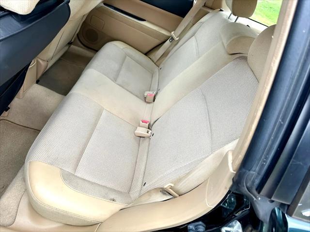 Photo of 2003 Woodland Green Pearl/Textured Gray Subaru Forester