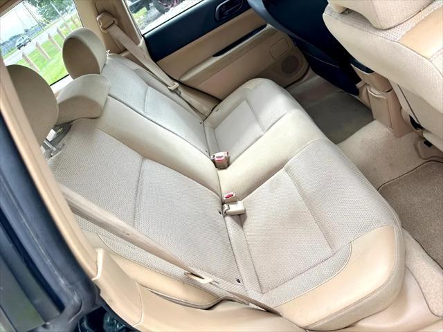 Photo of 2003 Woodland Green Pearl/Textured Gray Subaru Forester